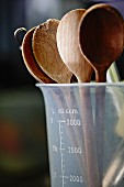 Wooden spoons in a measuring jug