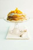 A crepes Suzette cake with an orange foam filling