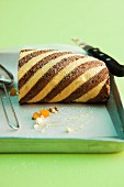 A striped Swiss roll with apricots and amaretto cream