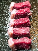 Picanha steak, sliced and salted