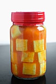 A jar of marinated tofu