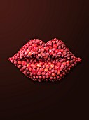 A pair of lips made from red berries
