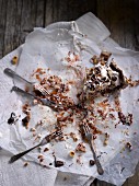 Leftover pavlova with nuts and chocolate on a piece of baking paper