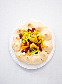 Pavlova with fresh fruits (seen from above)
