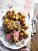 Lamb loin rack joint with a herb crust and rosemary potatoes