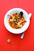 Mussels in a pepper and saffron broth with fried king prawns