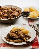 Coq au vin with mushrooms and new potatoes