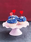 Cupcakes decorated with blue buttercream and hearts