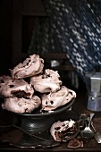 Chocolate meringues on a cake stand