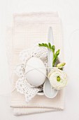 Egg decorated with flower and lace doily