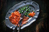 Smoked salmon and peas on a serving platter