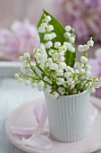 Lily-of-the-valley in white beaker