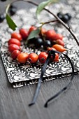 Wreath of rose hips and chokeberries on napkin