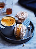 Meringue sandwiches with coconut filled with passion fruit ice cream