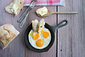 Fried eggs with bread and butter