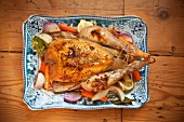 Roast chicken with root vegetables on a serving platter