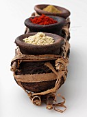 Moroccan spices in rustic wooden dishes