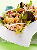 A mixed leaf salad with grilled salmon
