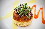Fried grits cake with fresh cress
