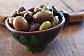 Mixed olives in a ceramic bowl