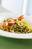 Spaghetti with stinging nettle pesto and a prawn skewer