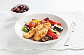 Fried fish fillets with roasted peppers