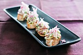 Slices of bread topped with tuna tartar