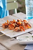 Fish and prawn skewers with herb yogurt