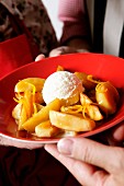 Orange and apple compote with vanilla ice cream