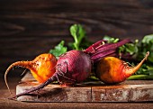 Fresh organic beetroot and golden beets on a chopping board