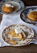 Pineapple cakes with cream, whole and with a bite taken out
