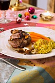 Roast beef with chanterelle mushrooms, carrots and duchess potatoes for Christmas dinner