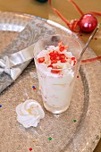 A cream dessert with pomegranate seeds for Christmas