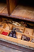 Collection of seeds in wooden organiser tray