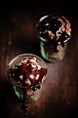 Chocolate ice cream with chocolate sauce in glasses