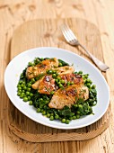 Grilled chicken breast with spinach and peas