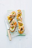 Baguette topped with cream cheese, pollack, carrots and leek