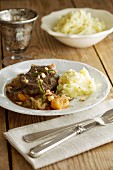 Braised beef with mashed potatoes and a vegetables sauce