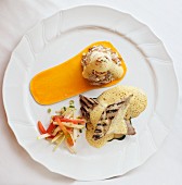 Grilled chicken fillets with foamy sauce and butternut squash