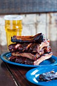 Grilled pork ribs and a glass of beer in a pub