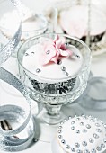 Festive cupcakes decorated with silver pearls and sugar flowers