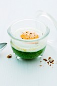 Creamy spinach with egg cooked in jars