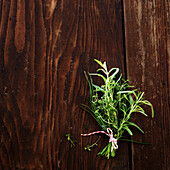 Bouquet of herbs on wood