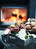 Mulled wine and Christmas biscuits in front of a fire place
