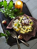 Soused herring salad with egg, potatoes and capers (Scandinavia)
