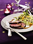 Roast beef with a fruity cabbage salad