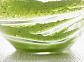 Remains of herb butter in a glass bowl