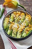 Stuffed courgette flowers in a baking dish