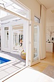 Elegant, white house with open terrace doors