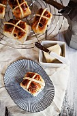 Hot cross buns, butter and coffee